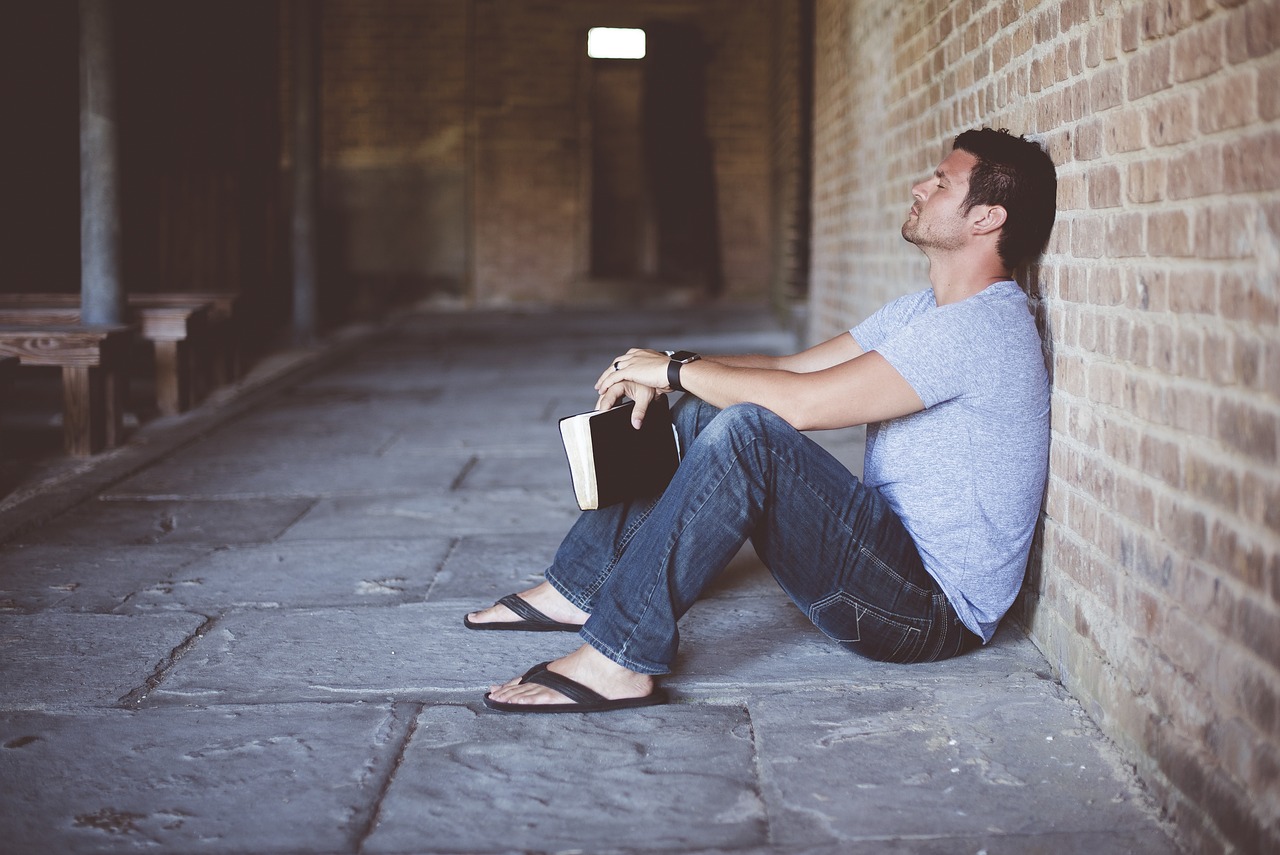 alone book brick wall man person 1869997