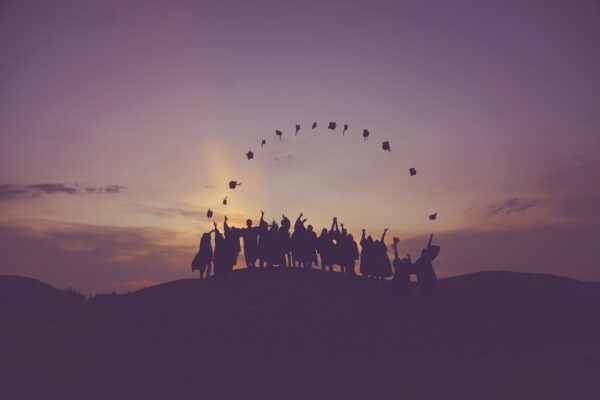 dawn graduates throwing hats dusk 1840298