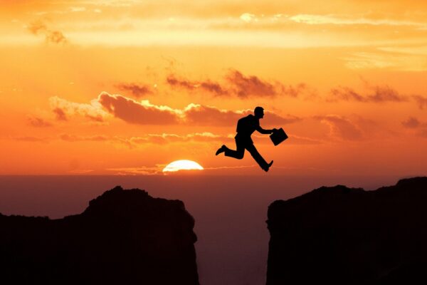 jump cliff sunset businessman 5266634