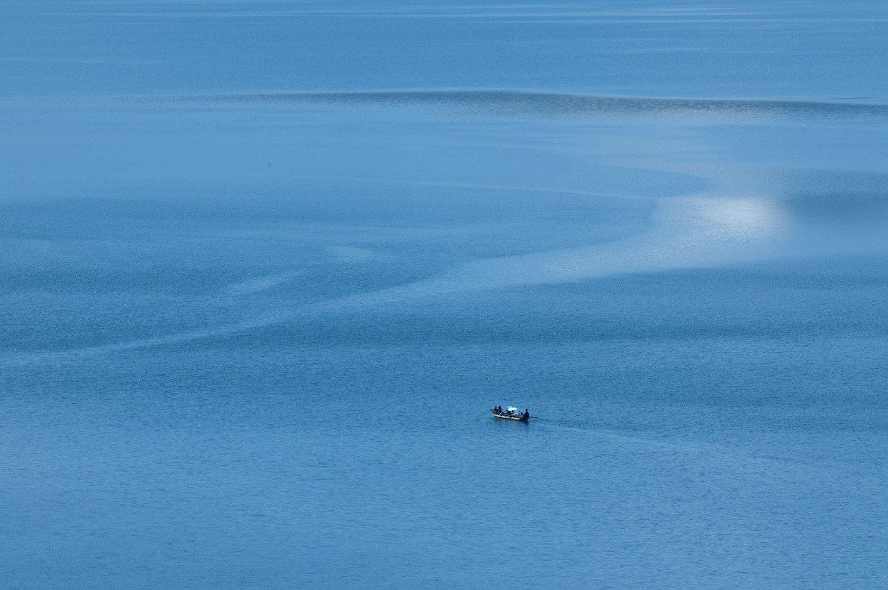 lugu lake boat lake blue horizon 8679121