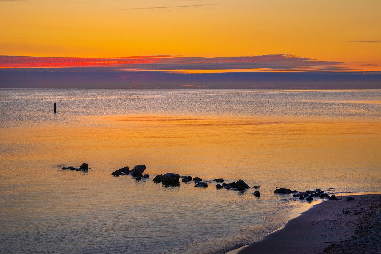 sunrise sea baltic sea lake beach 8235458