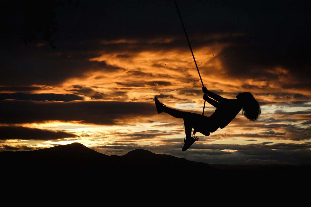 sunset rope swing girl silhouette 5737120